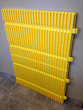 The sheet material for round columns is corrugated on the column-facing side for better fit and improved impact absorption